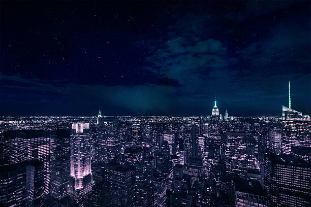 Manhattan during night View over Manhattan Skyline in the night image created 21st century blue architecture wide angle lens stock pictures, royalty-free photos & images