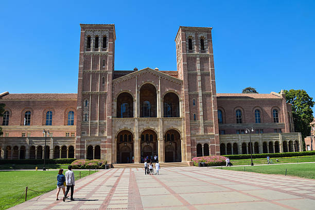 Royce Hall at the University of California Los Angeles  (UCLA) Los Angeles, California, USA - July 9. 2015: A group of studens walk past Royce Hall at the Univrsity of California, Los Angeles (UCLA) campus. ucla photos stock pictures, royalty-free photos & images
