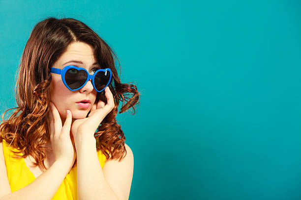 istock Girl in blue sunglasses portrait 494975320