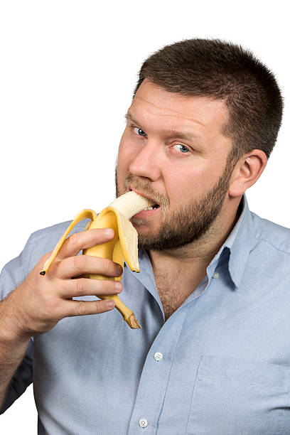 istock Bearded man eating a banana 494976374