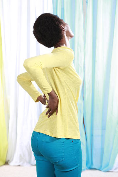 istock African woman with back pain 494976834