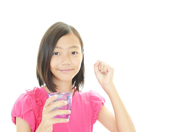istock Happy Asian girl drinking fresh water 494978395