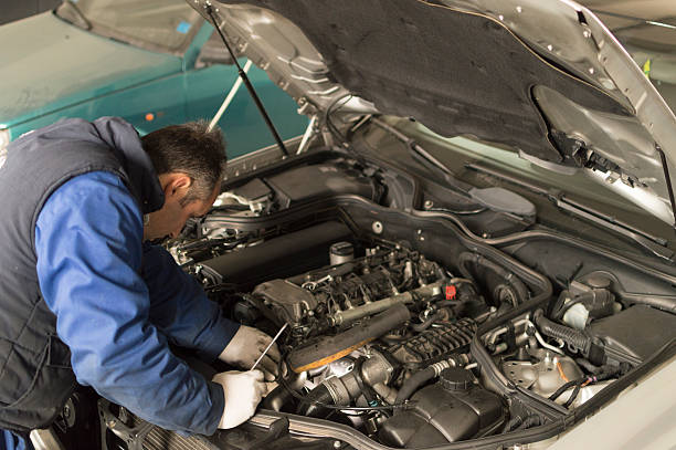 istock auto mechanic makes inspection and check a diesel engine car 494979859