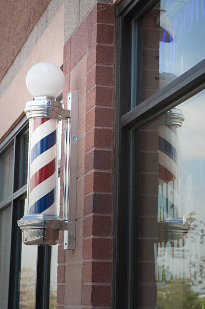 istock Barber pole outside of local barber shop 494979909