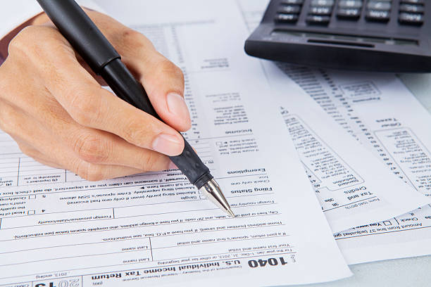 istock Filling out income tax forms 494980341