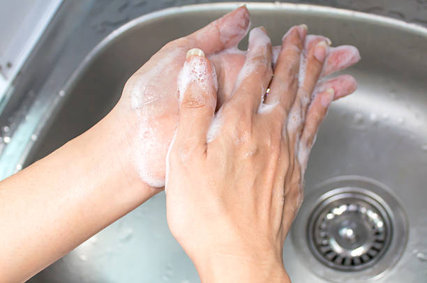 istock Washing of female hands with soap 494980393