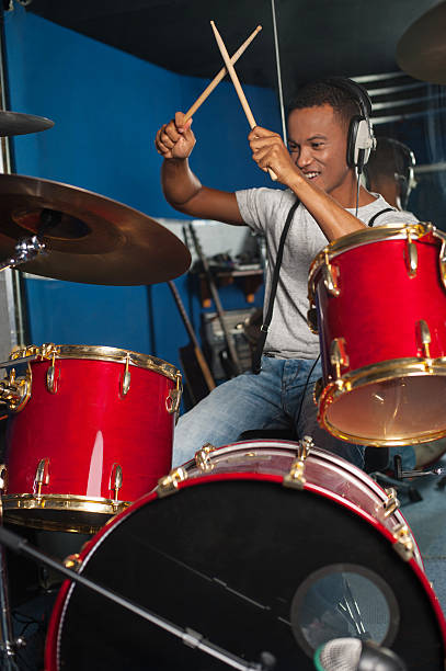 istock Cheerful musician playing drums 494981683