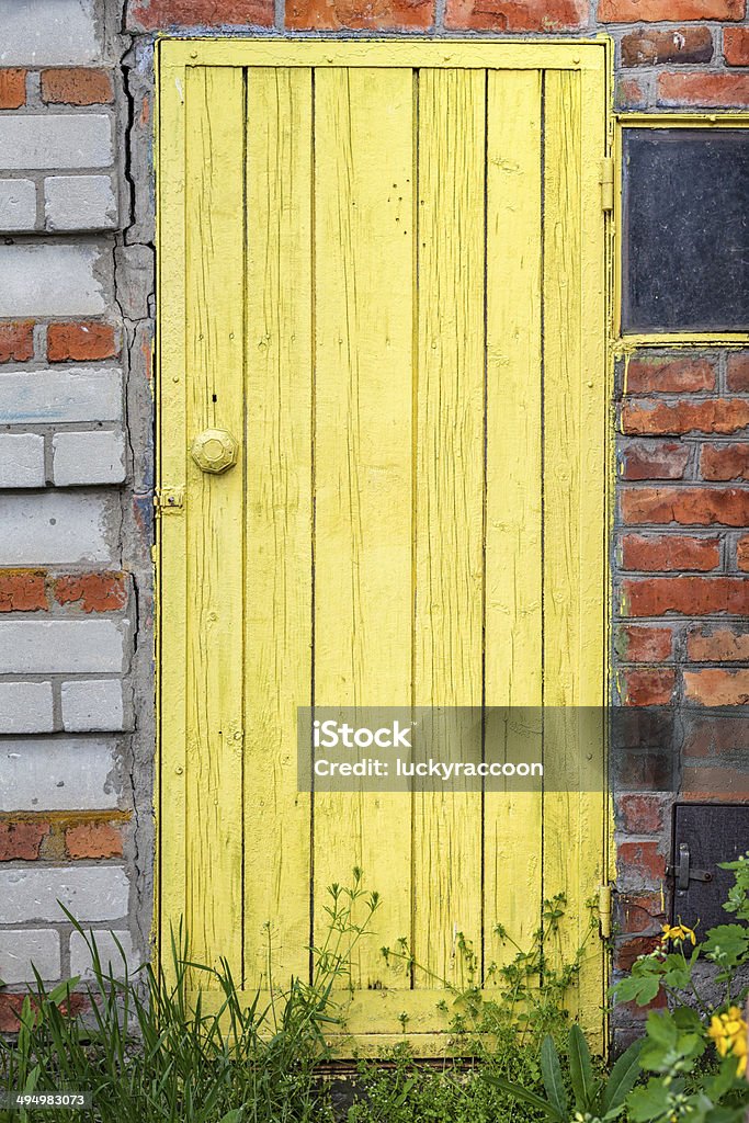 Old weathered door with knob. Barn Stock Photo