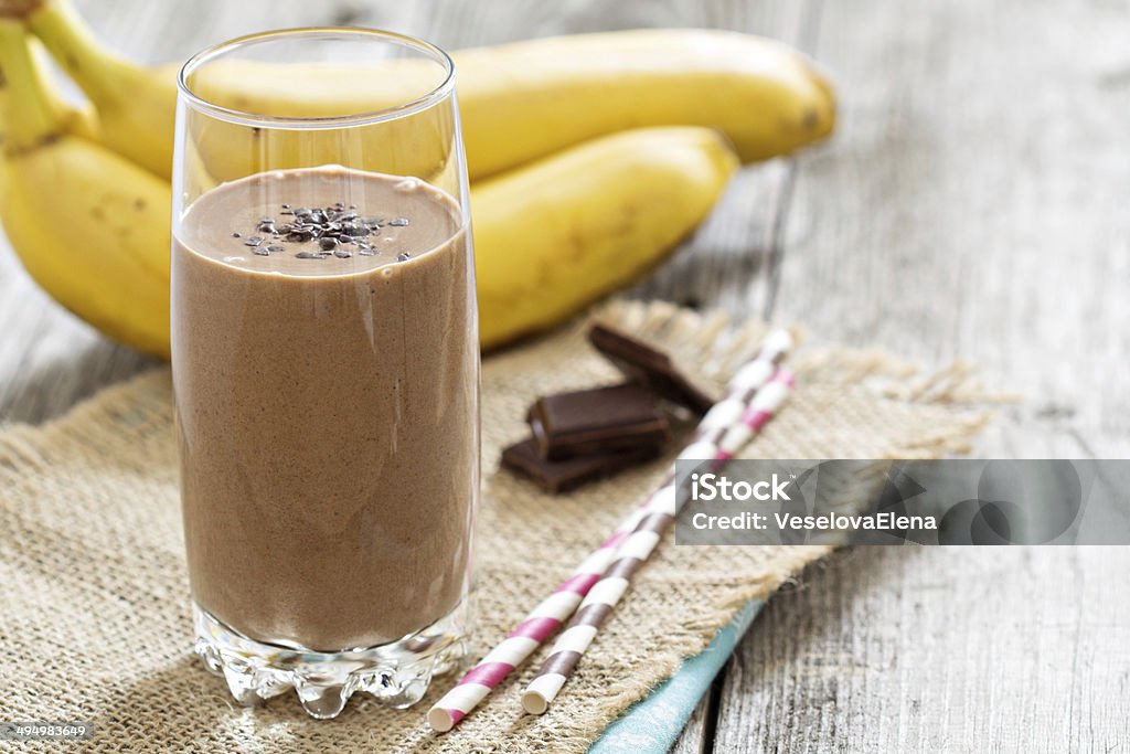 Chocolata banana smoothie Chocolata banana smoothie in a glass with straws Chocolate Stock Photo