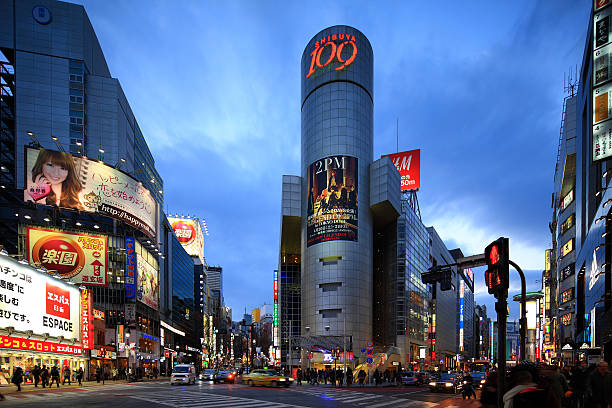 Sibuya,Tokyo,Japan Tokyo,Japan- February 11, 2013:Twilight shot of Shibuya Dogenzaka-Shita Crossing in Tokyo on February 11, 2013. Shibuya is one of the most famous and busiest shopping district in Tokyo. shibuya district stock pictures, royalty-free photos & images