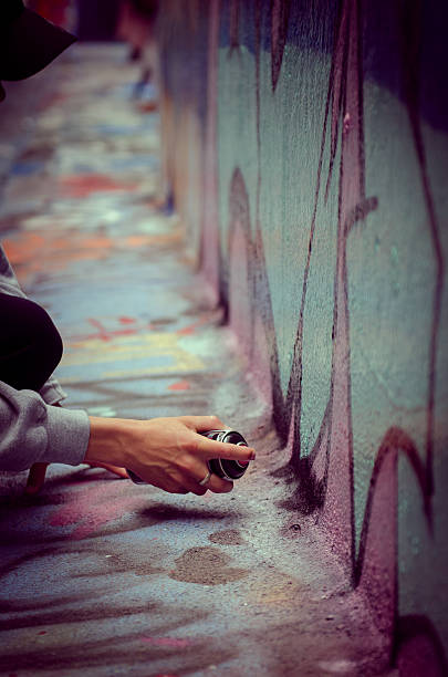 istock Boy Spray Painting Street Art 494985167