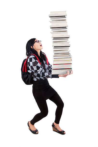 istock Female student lifting many books 494985569