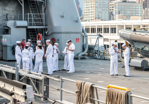 New York, NY - May 26, 2014: US Sailors on the deck of the USS Oak Hill during Fleet Week 2014 in New York City