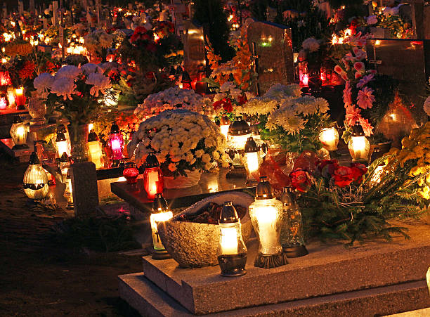 istock Candles Burning At a Cemetery During All Saints Day 494991528