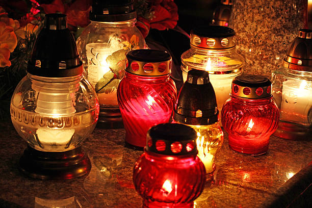 istock Candles Burning At a Cemetery During All Saints Day 494991632