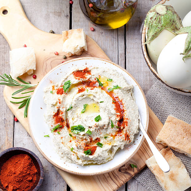 istock Traditional arabian eggplant dip baba ganoush with herbs, smoked paprika 494992016