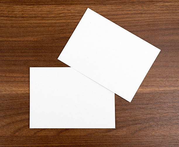 istock Two blank cards on wood table 494992166