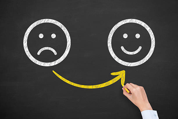 istock Hand Drawing Unhappy and Happy Smileys on Blackboard 494992334