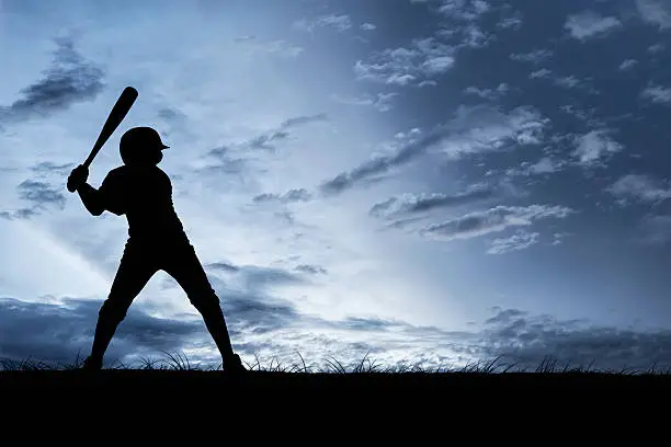 A young baseball player ready to swing. Hand drawn silhouette