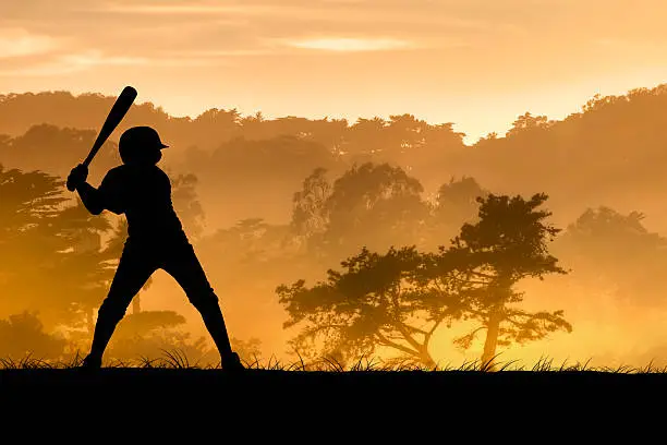 A young baseball player ready to swing. Hand drawn silhouette