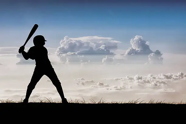 A young baseball player ready to swing. Hand drawn silhouette