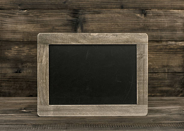 istock Blackboard chalkboard on wooden background. Vintage texture 494994964