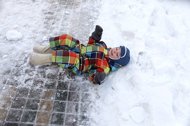 istock Child lying in the snow 494994972