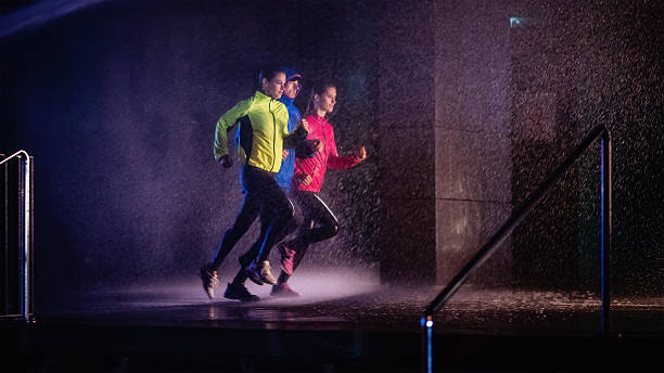 Joggers running on rainy night