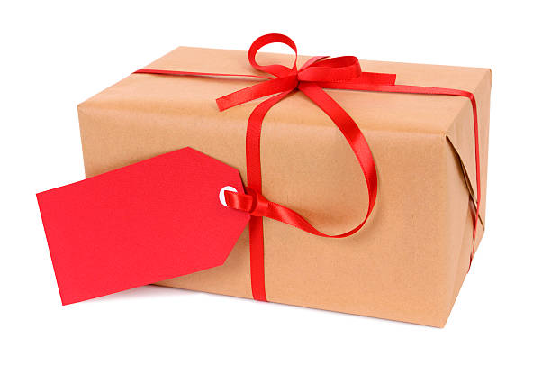 istock Brown paper package or gift tied with red gift tag 494997374