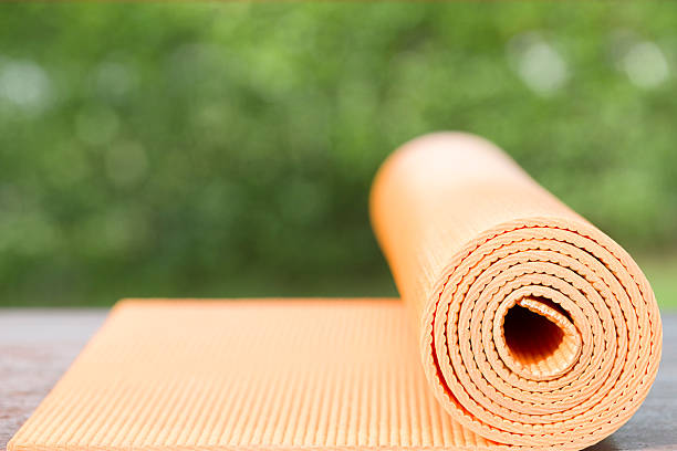 istock yoga mat on the table in a garden 494998928