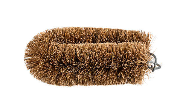 Cleaning brush made from coconut husk over white background
