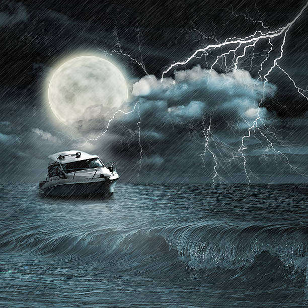 istock Boat in storm  evening on ocean and the moon 495004291