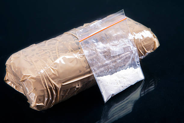 Cocaine powder Cocaine powder in plastic bag with a packages cocaine stock pictures, royalty-free photos & images