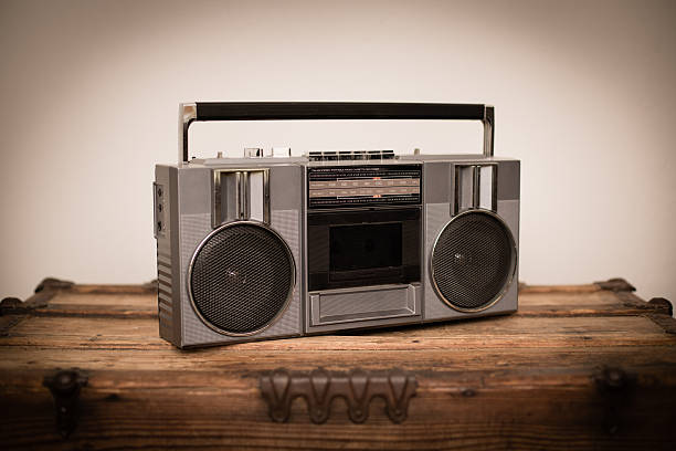 istock Portable Boom Box, Sitting on Old Wood Trunk 495006603