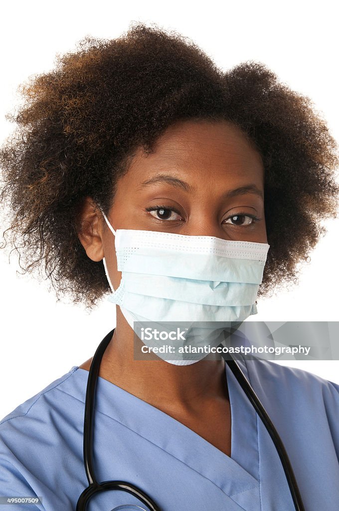 African American Nurse Closeup of an African American Nurse wearing a surgical mask Adult Stock Photo