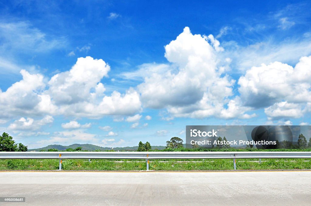 Beautiful roadside view with green nature and cloudy blue sky Beautiful roadside view with green nature and cloudy blue sky  bachground Backgrounds Stock Photo
