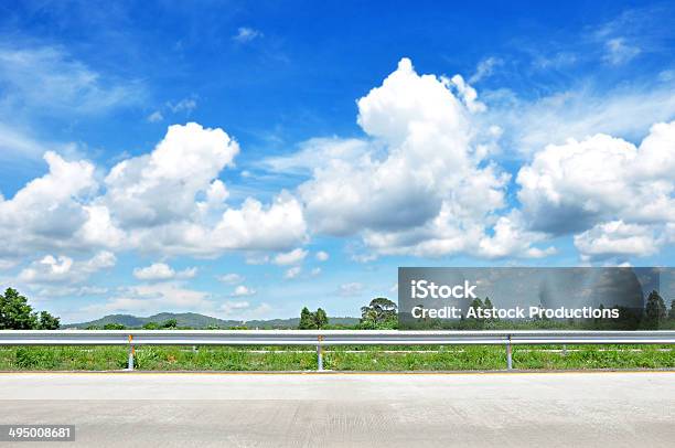 Beautiful Roadside View With Green Nature And Cloudy Blue Sky Stock Photo - Download Image Now