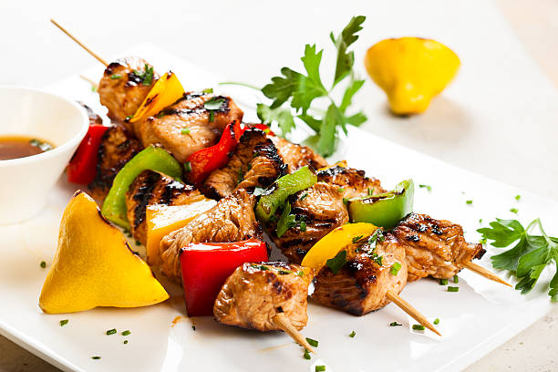 meat and vegetable kebabs Grilled meat and vegetable kebabs on the white plate kebab stock pictures, royalty-free photos & images