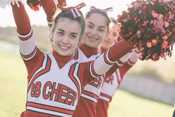 istock Group of Cheerleaders with Raised Pompom 495009885