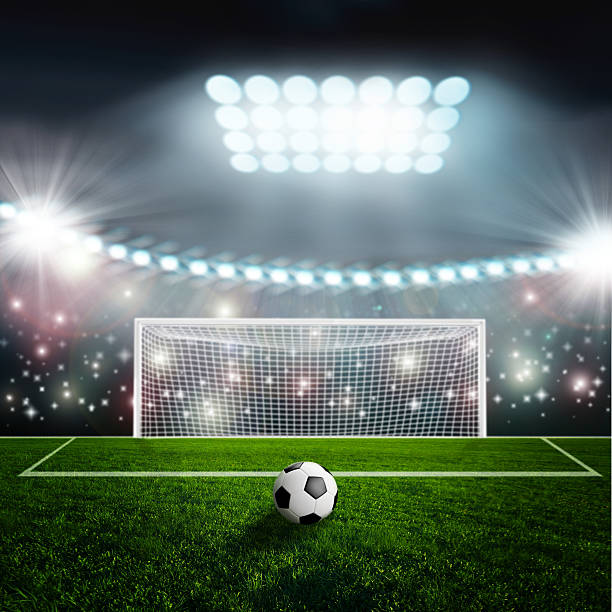 istock Soccer ball on green stadium arena 495010295