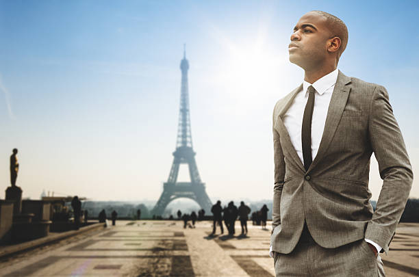 istock Business man standing against the Tour Eiffel 495011207
