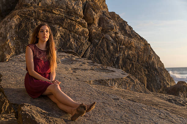Smile Freedom and happiness woman on beach. She is enjoying serene ocean nature outdoors.