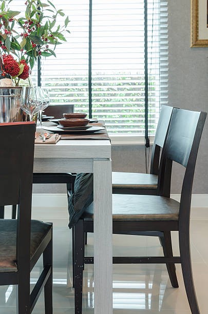 istock white wooden dinning table with dark wooden chairs 495019850