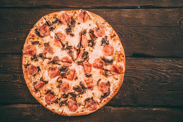 istock Homemade Pizza with ham and mushrooms 495023730