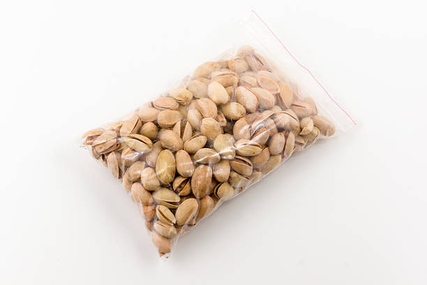 istock transparent plastic package full of dry pistachios 495035856