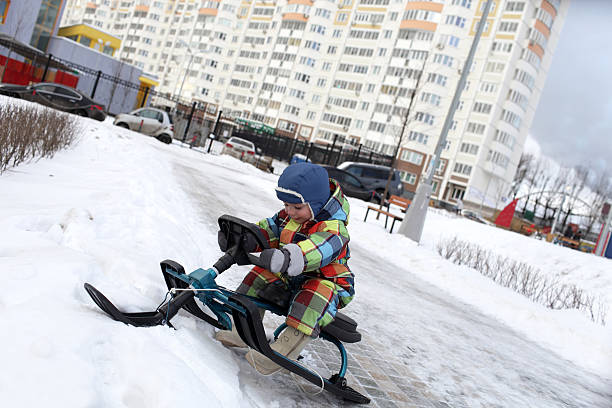 istock Toddler on a snow scooter 495035982