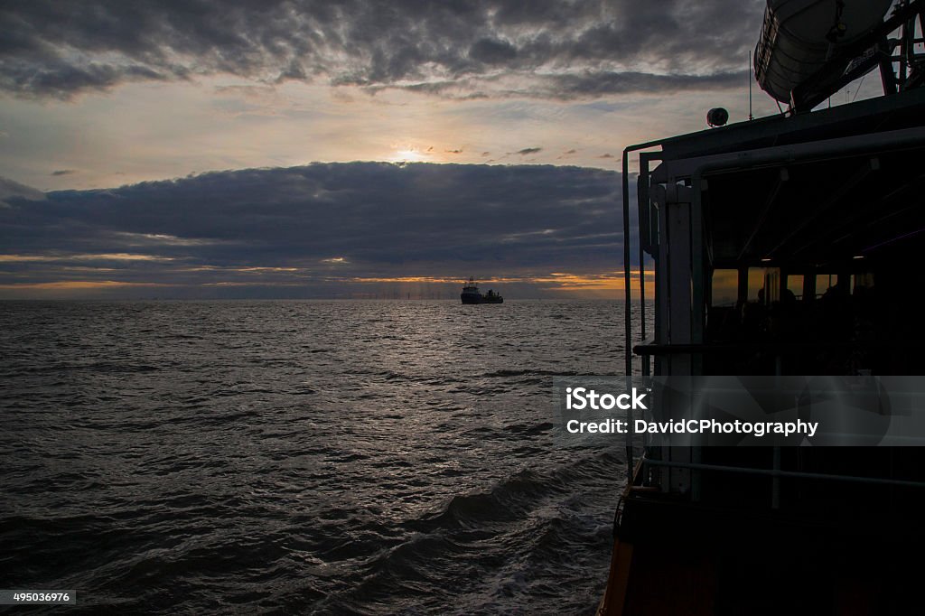 Calm Water Twilight Twilight tones over Liverpool Bay whilst on an evening cruise in the Mersey estuary 2015 Stock Photo