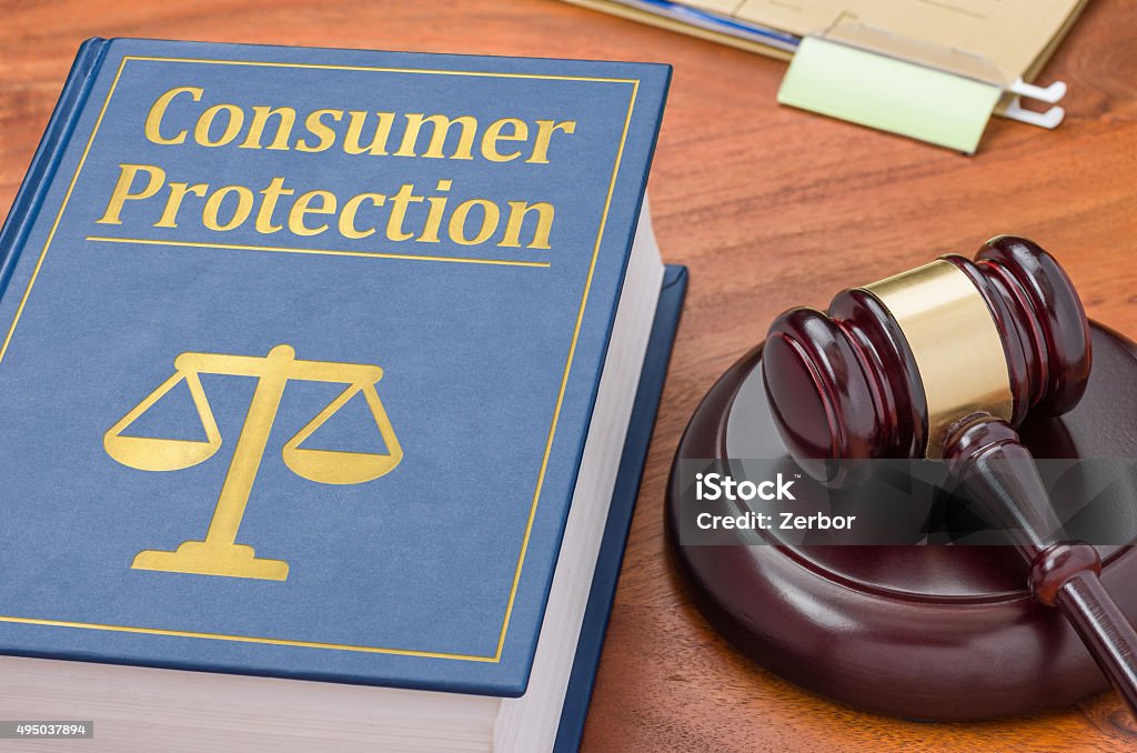 Law book with a gavel - Consumer Protection A law book with a gavel - Consumer Protection Consumerism Stock Photo