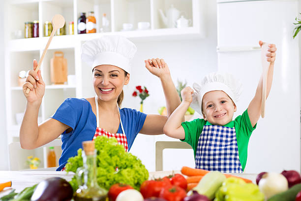 istock Smiling happy beautiful family ready for cook 495039978
