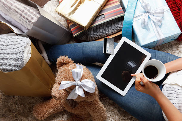 Woman shopping  with a credit card at home stock photo